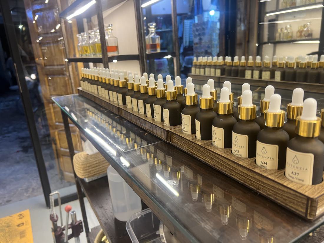 Perfume notes lined up on the GUTENZIA workshop counter, custom perfume in Marrakech